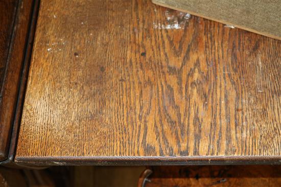 An oak refectory table, with trestle end supports, W.206cm